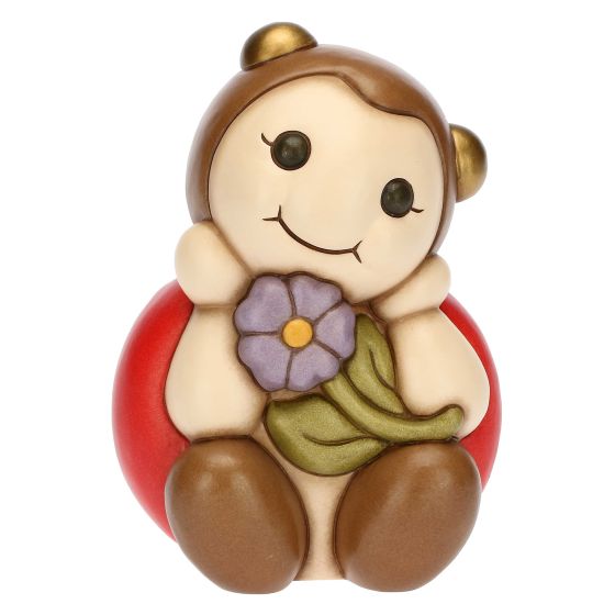 Coccinella con fiore